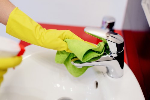 Carpet cleaning team preparing equipment with safety measures in place