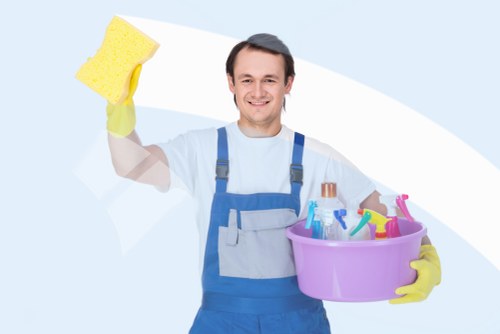Professional cleaner inspecting a carpeted area before cleaning begins